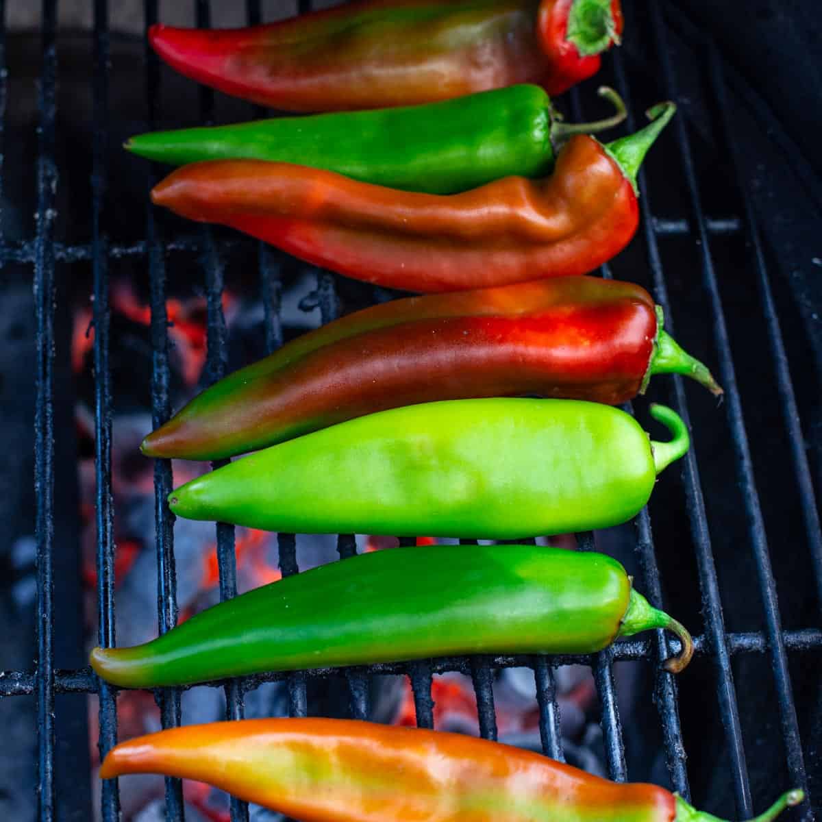 Fresh Green Chile over direct heat on a grill.