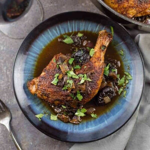 Ancho grilled chicken with chile and prune sauce.