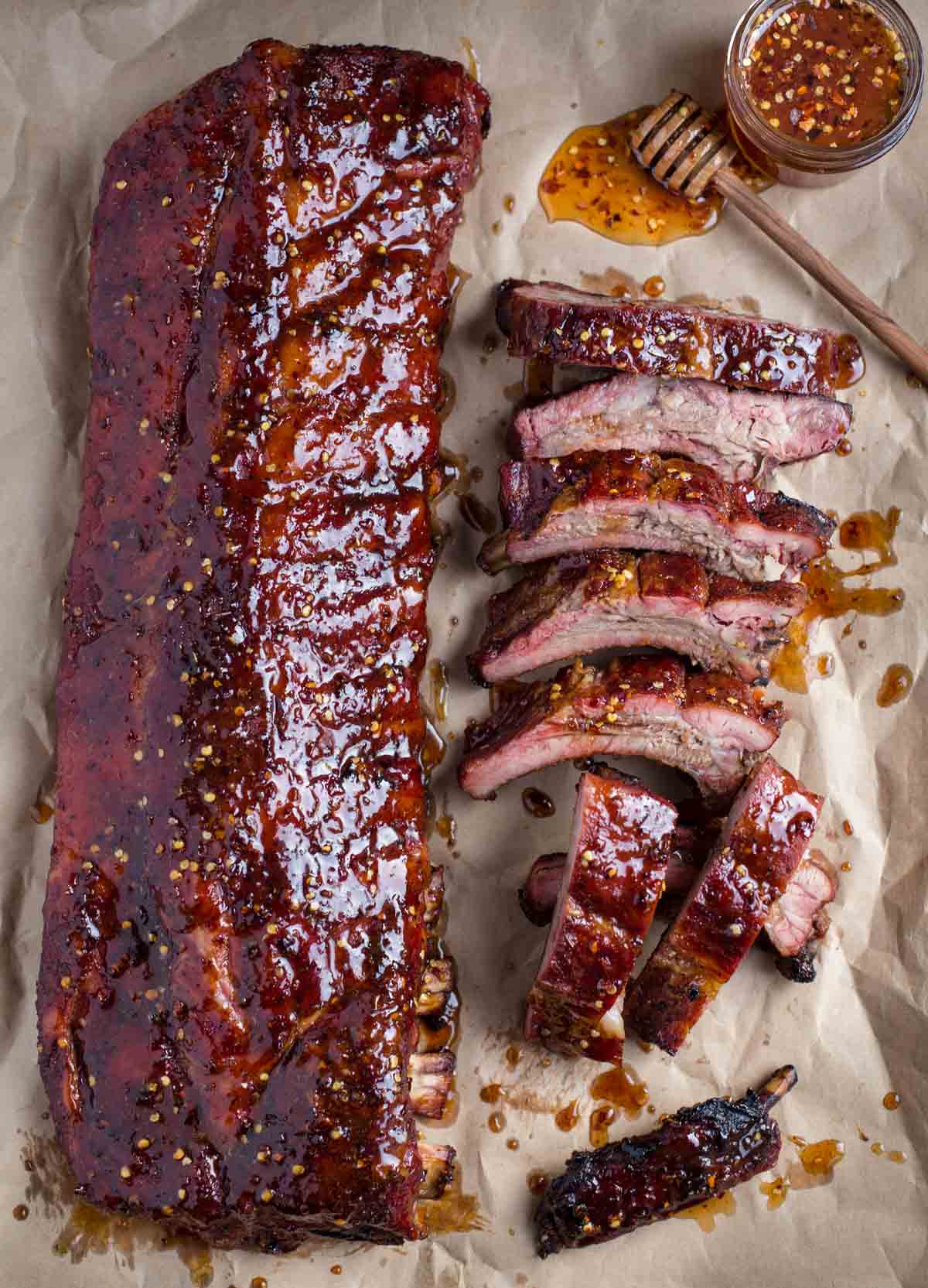 Two racks of Hot Honey Smoked Ribs over butcher paper