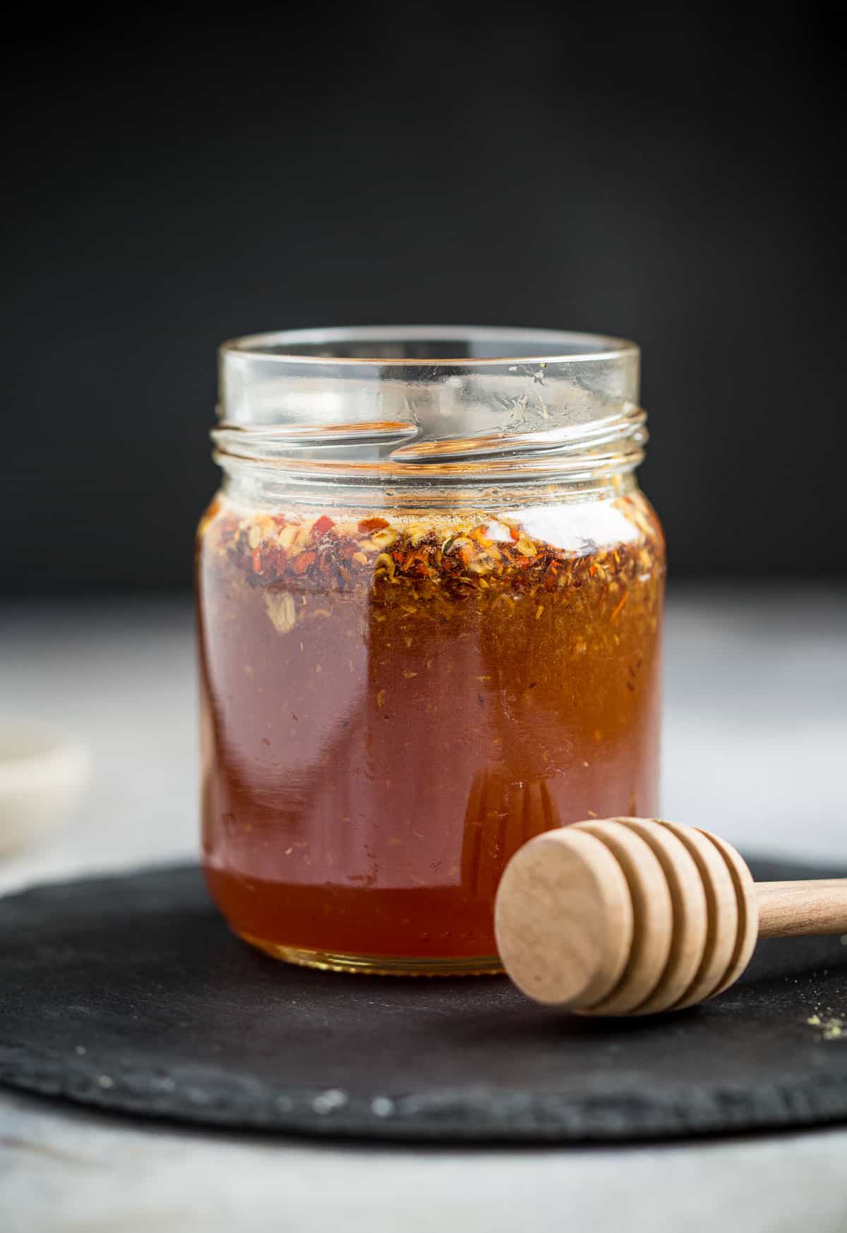 Hot honey with ginger and garlic in a jar.