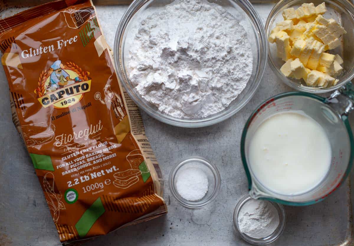 Ingredients for gluten free drop biscuits on a sheet pan 