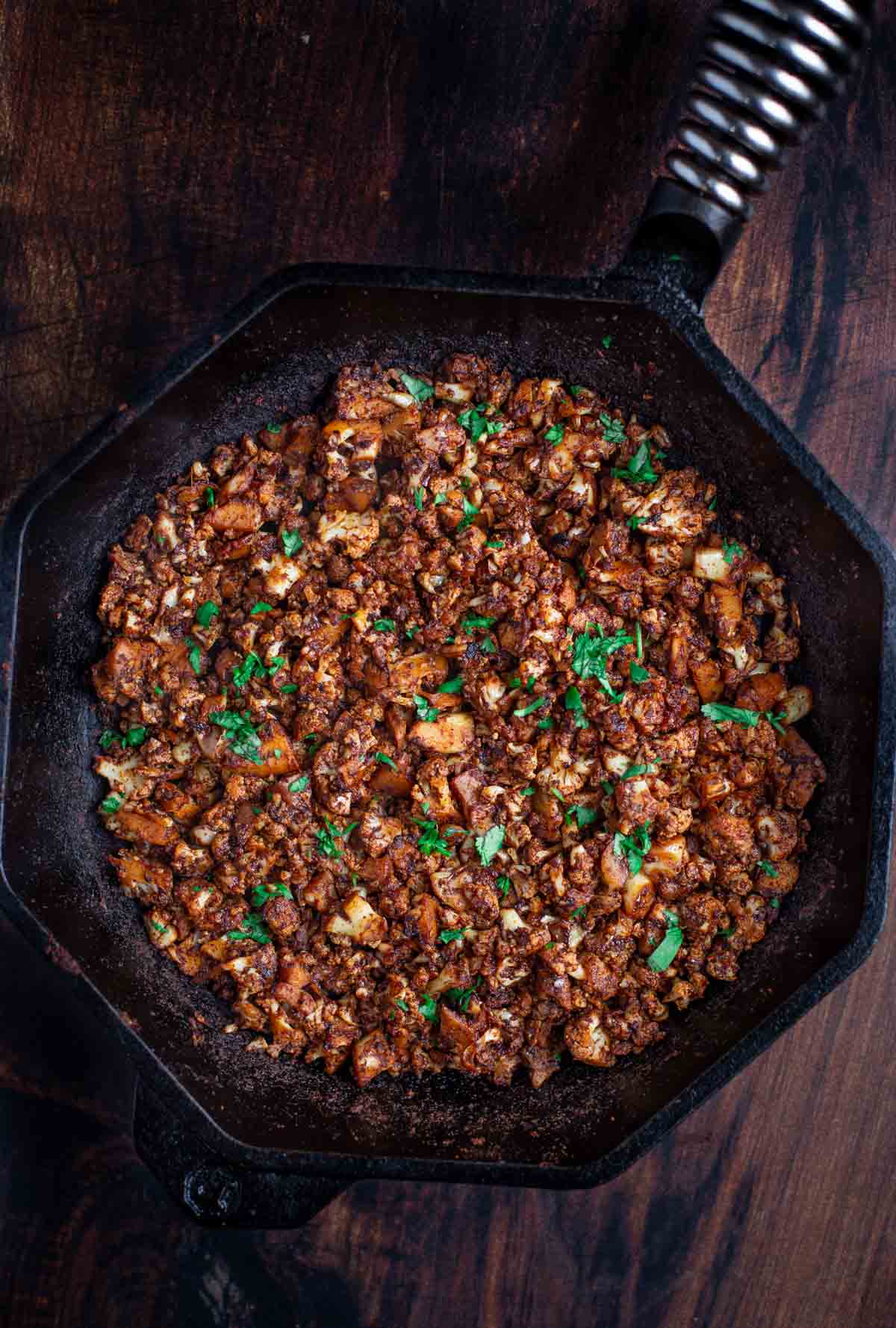 Cauliflower Vegetarian Chorizo in a cast iron pan