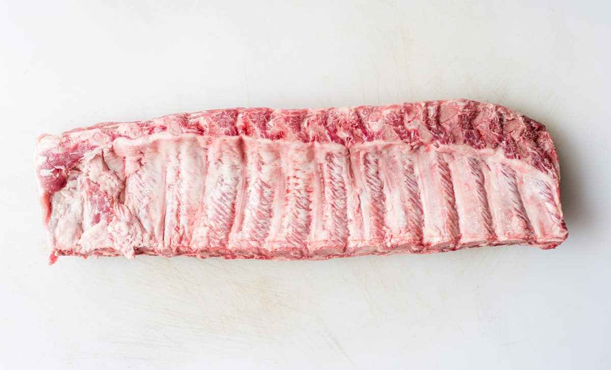 raw rack of ribs bone side