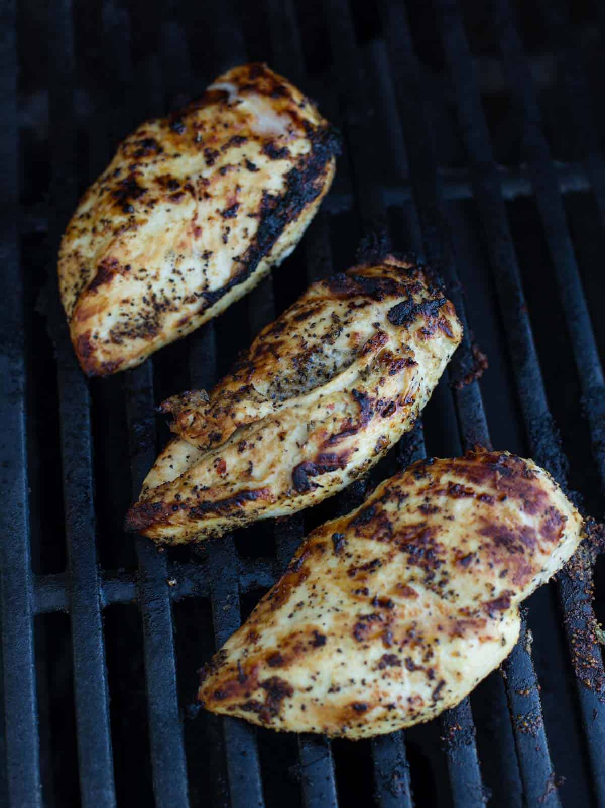 Grilled Lemon Pepper chicken over direct heat on a gas grill.