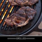 Grilled Ribeye Steaks cooking on a Solo Stove Bonfire with Hub grill grate.