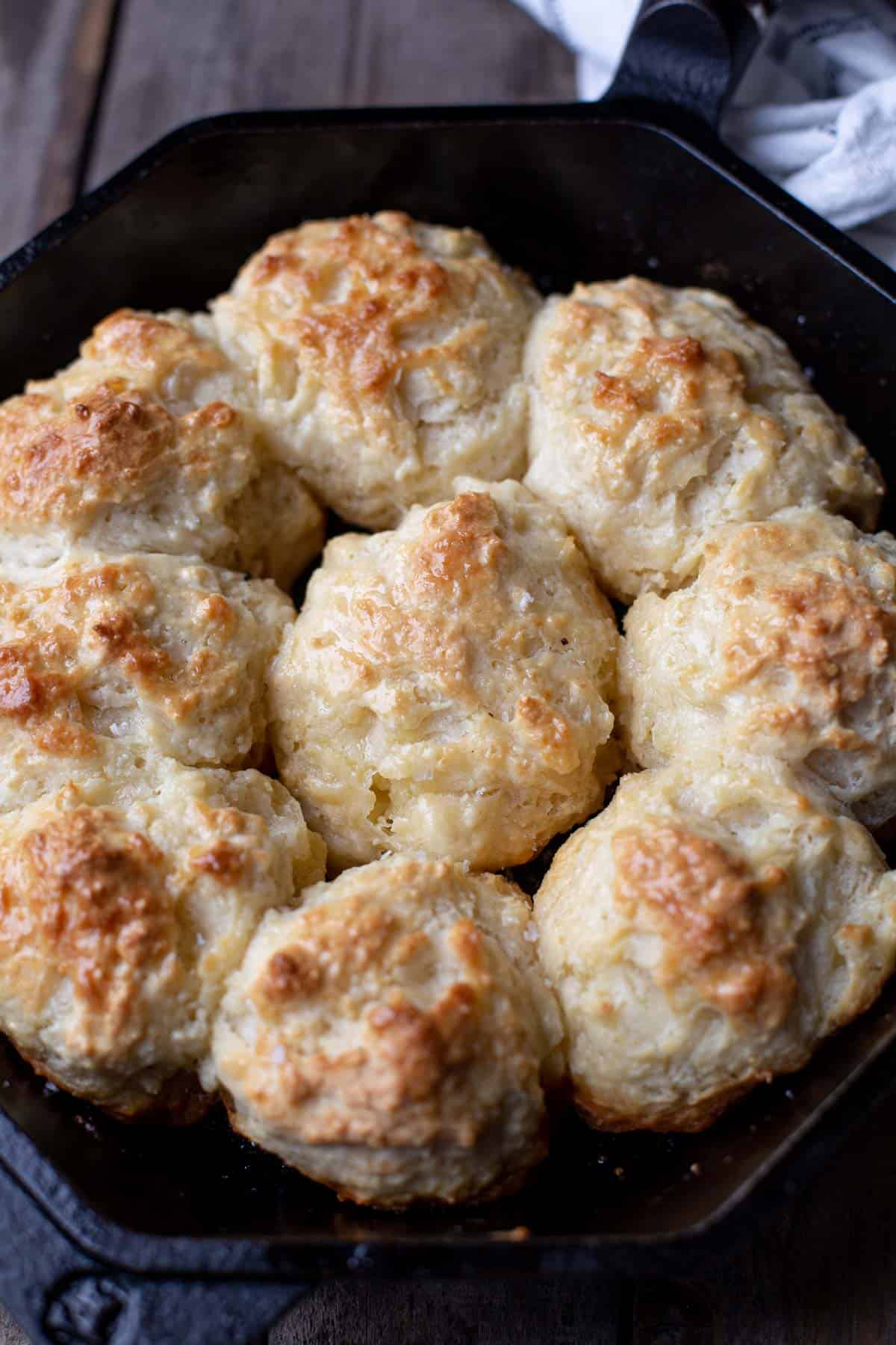 Close up of 9 Drop Biscuits made in a cast iron pan.