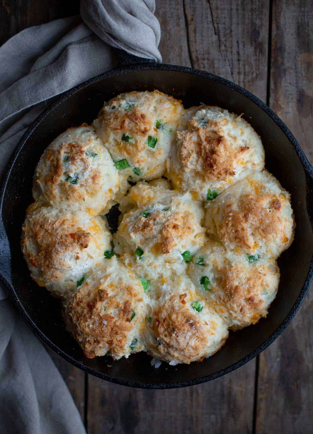 Cheddar and jalapeño gluten-free drop biscuits in cast iron.