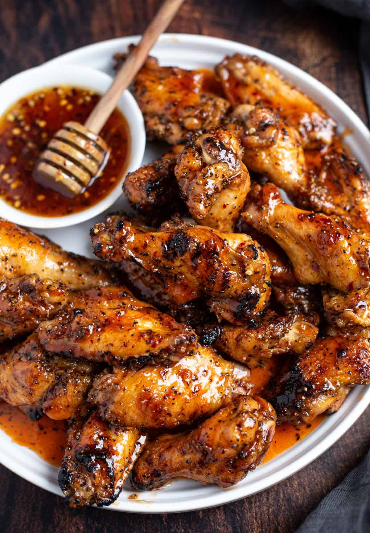 Buffalo hot honey wings on a platter.