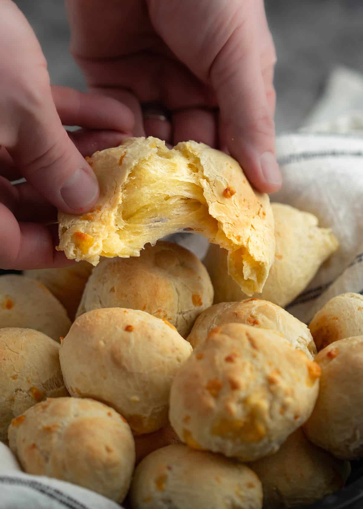 A pao de queijo bread ball split in half