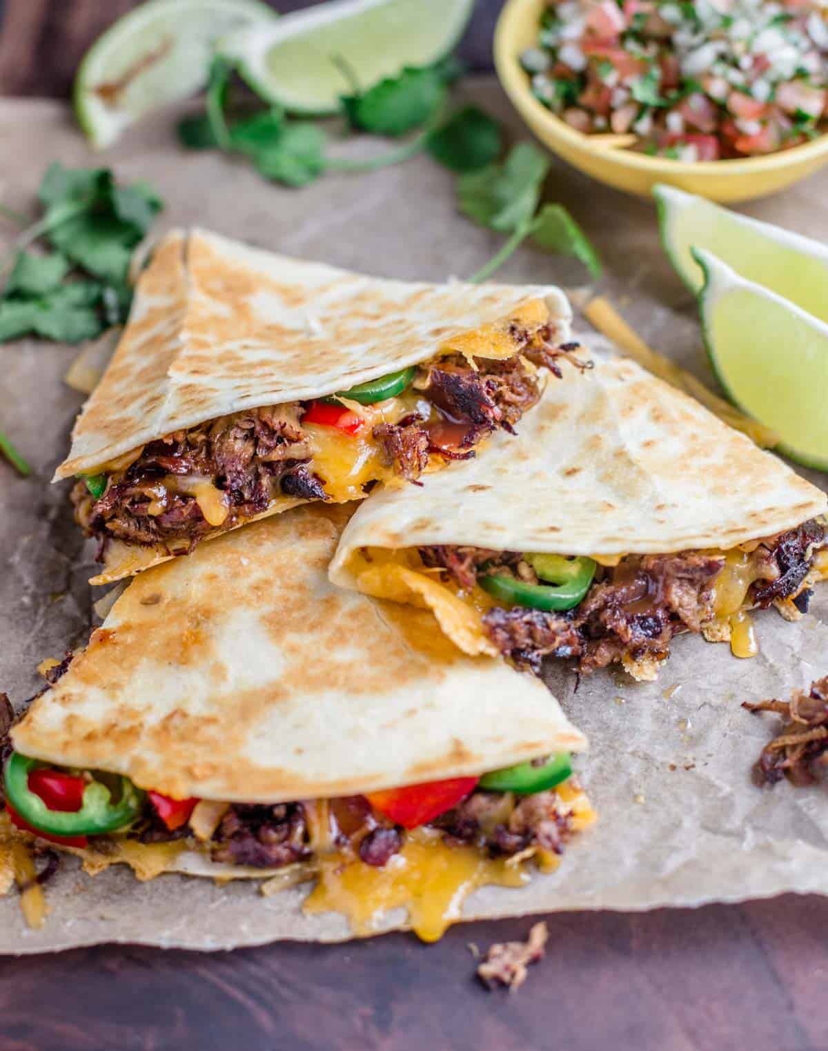 Smoked Pulled Beef Quesadillas on a cutting board.
