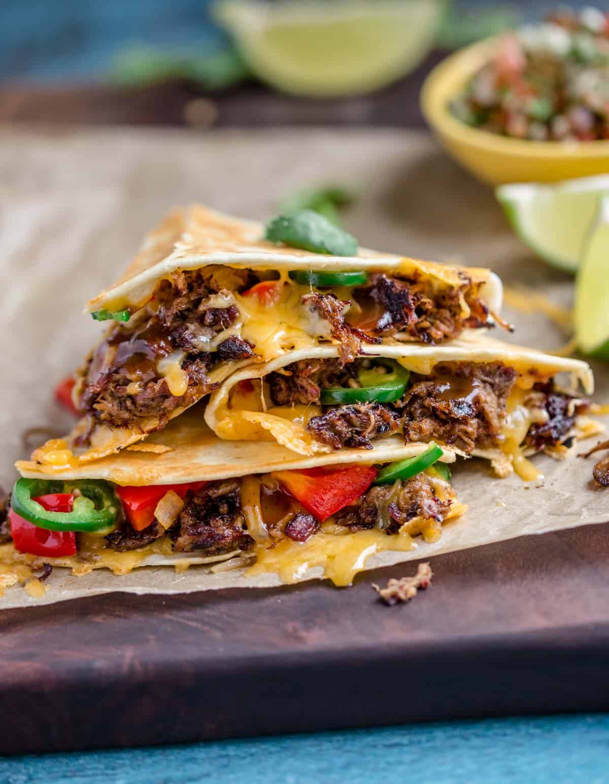 Beef Quesadillas sliced up and on a cutting board.