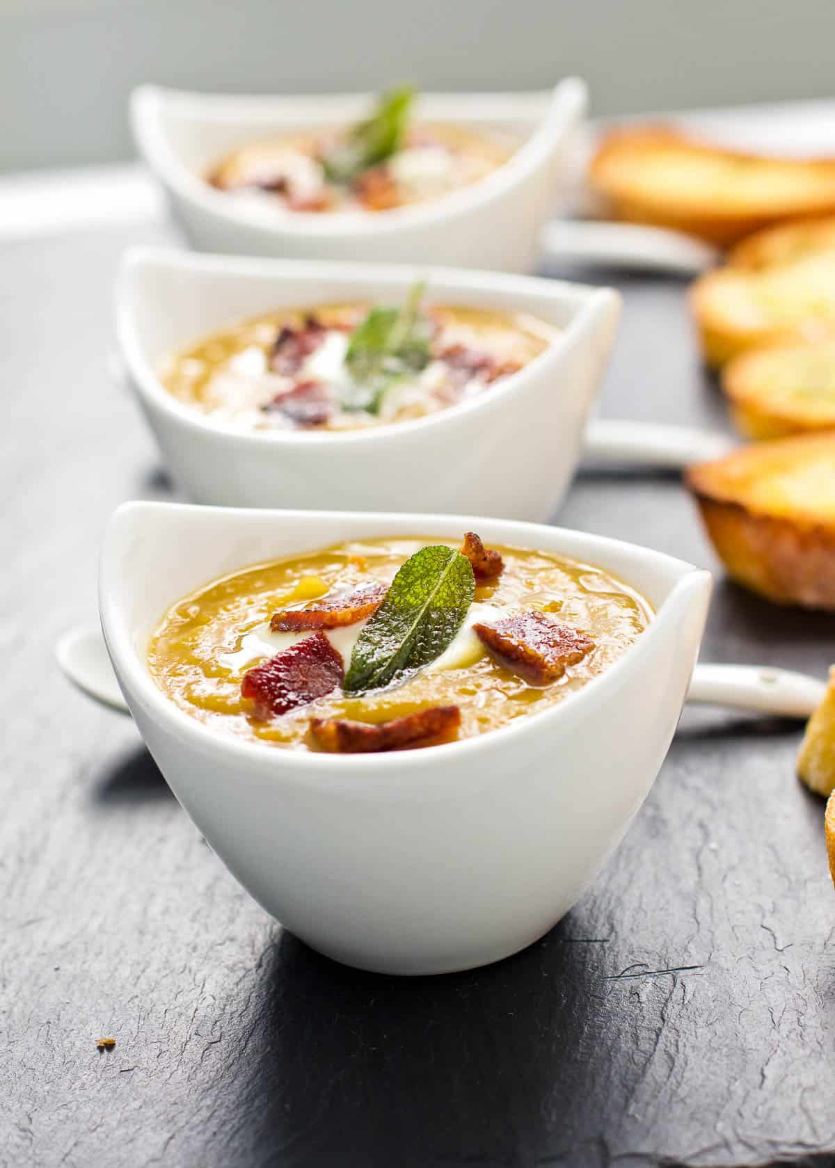 smoked butternut squash soup in serving bowls 