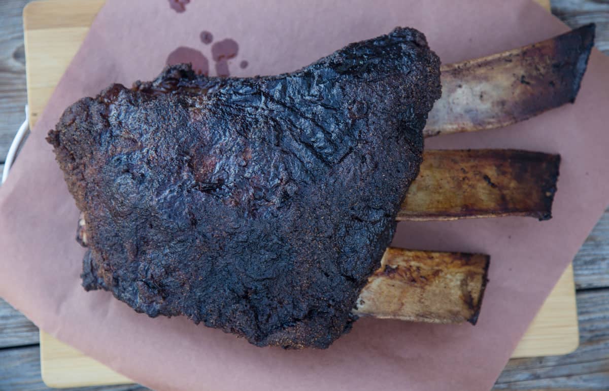 Smoked beef ribs, resting on butcher paper