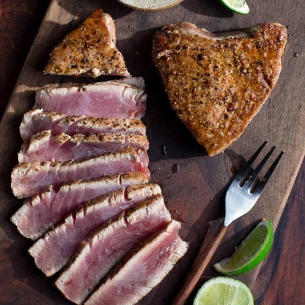 Slices of Grilled Ahi Tuna Steaks on a cutting board