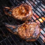 Grilled tomahawk pork chops over direct heat.