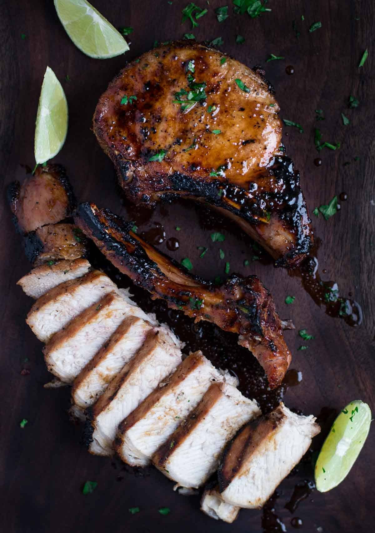 Sliced grilled pork chop with a maple and soy glaze.