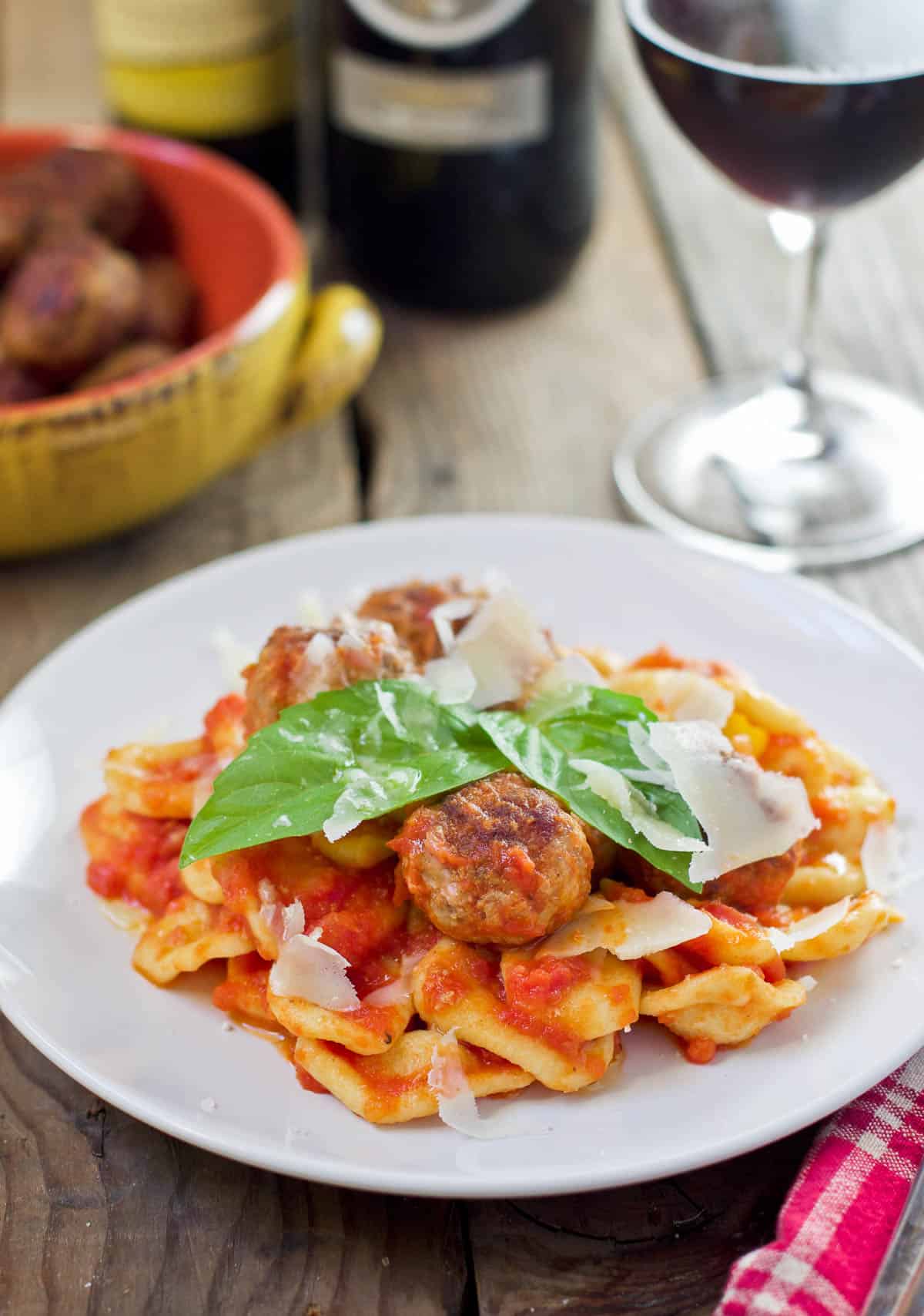 Orecchiette Pasta with tomato sauce and meatballs on a platter