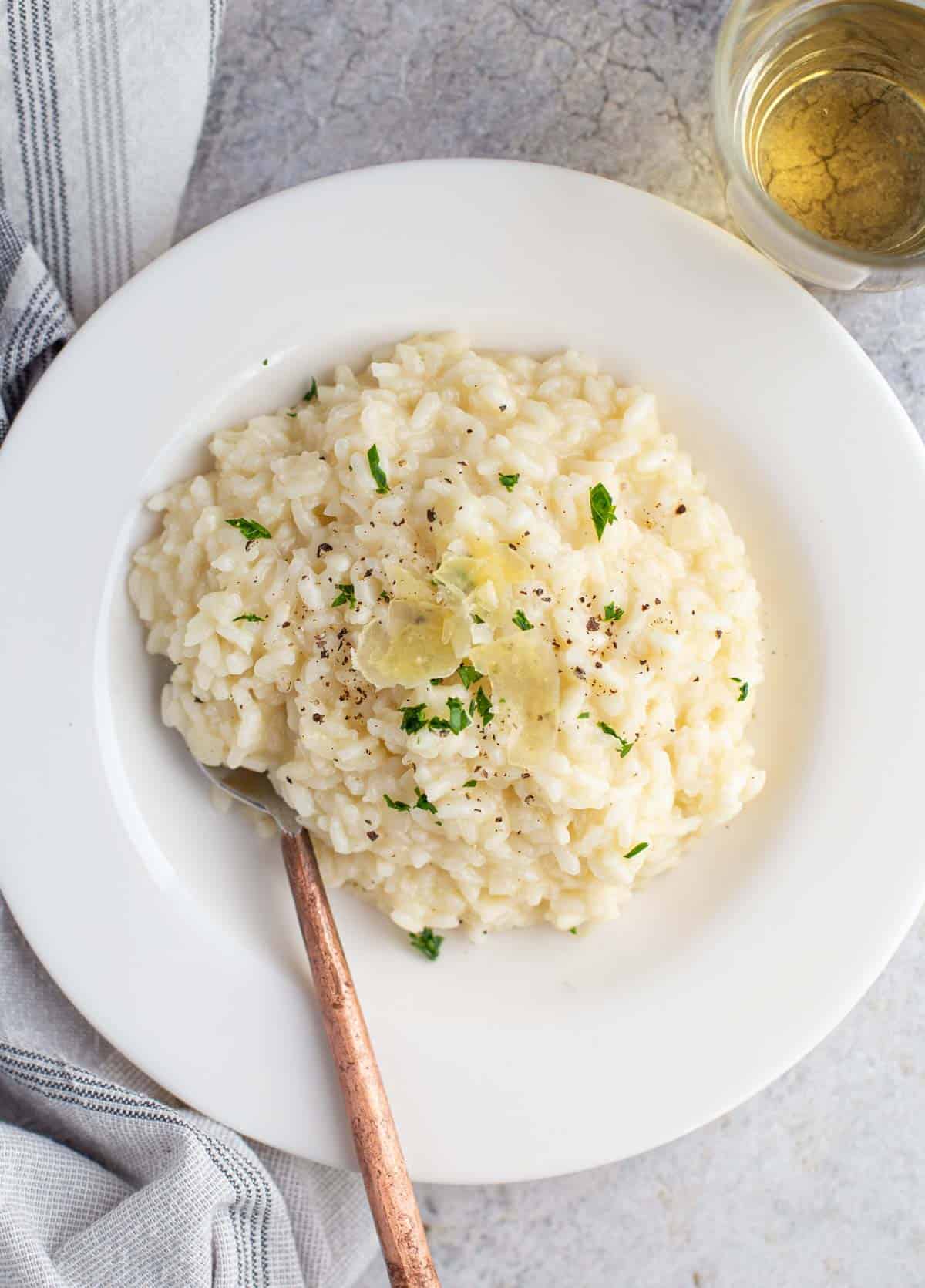 A bowl of Prosecco risotto with Prosecco wine.