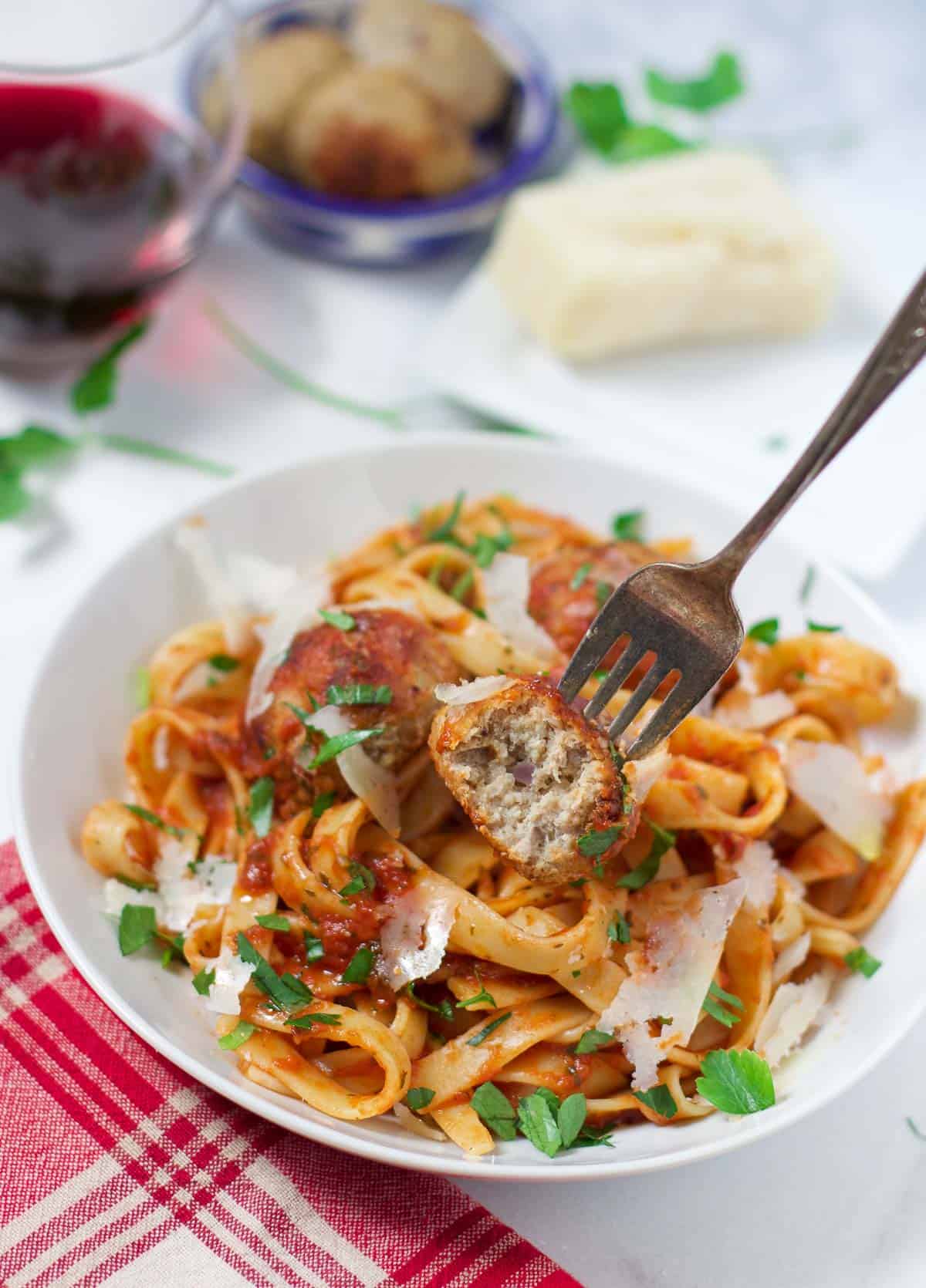 Smoked Turkey Meatballs with bacon paste over a bowl of pasta