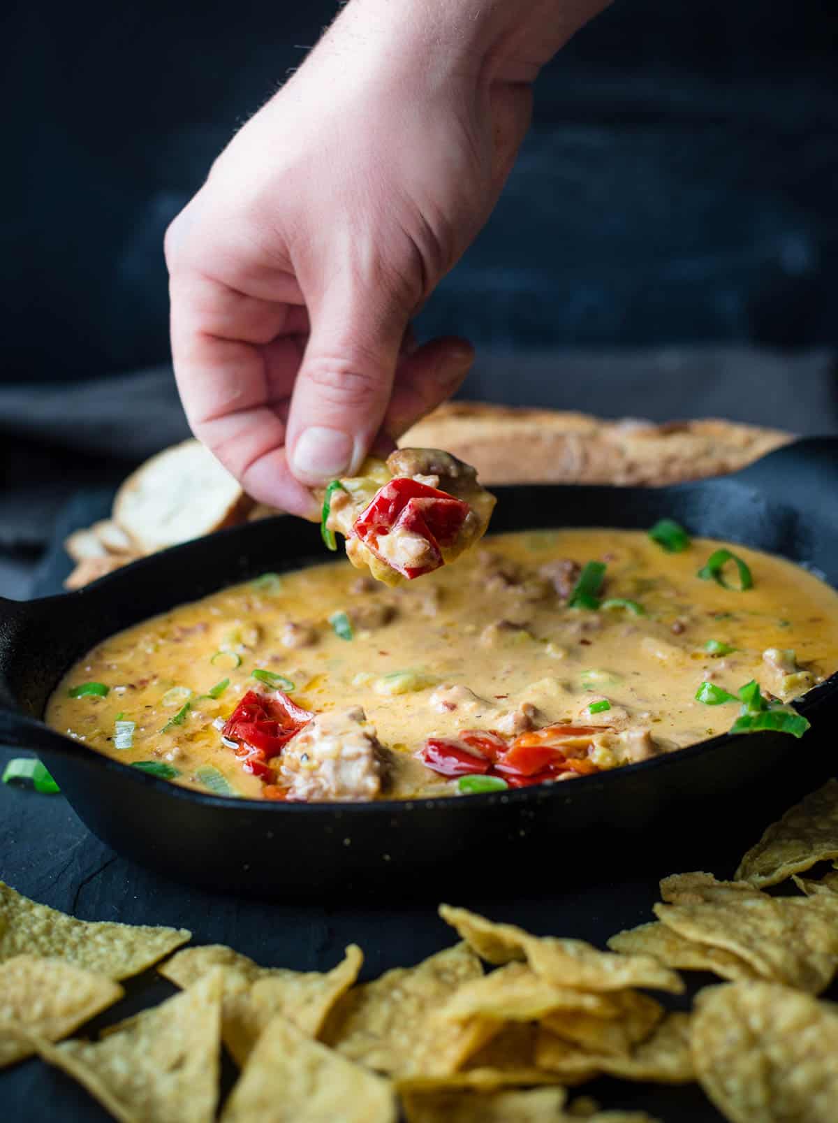 A spoonful of Smoked Sausage Beer Cheese Dip
