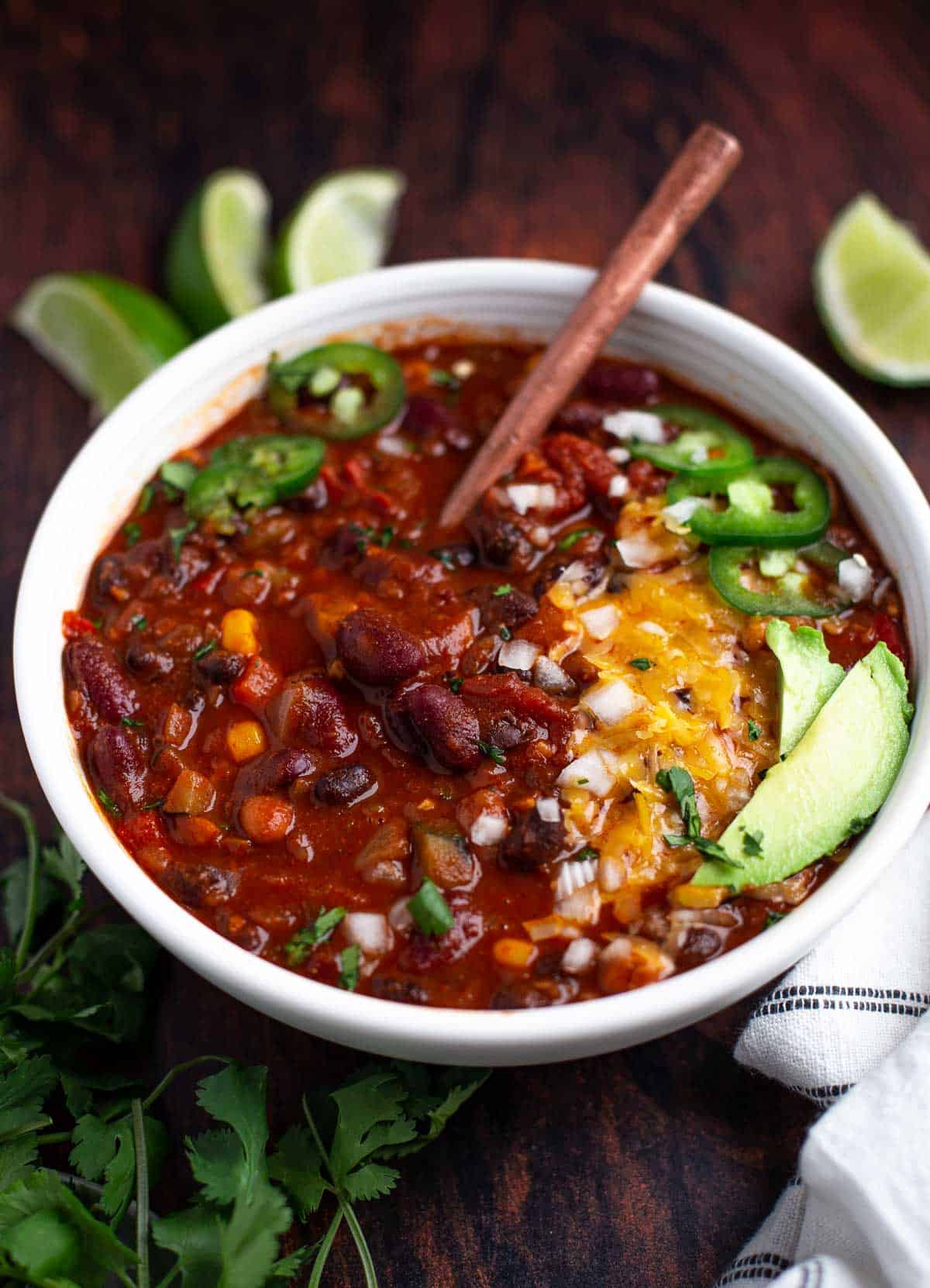 A bowl of the best vegetarian chili with chili toppings