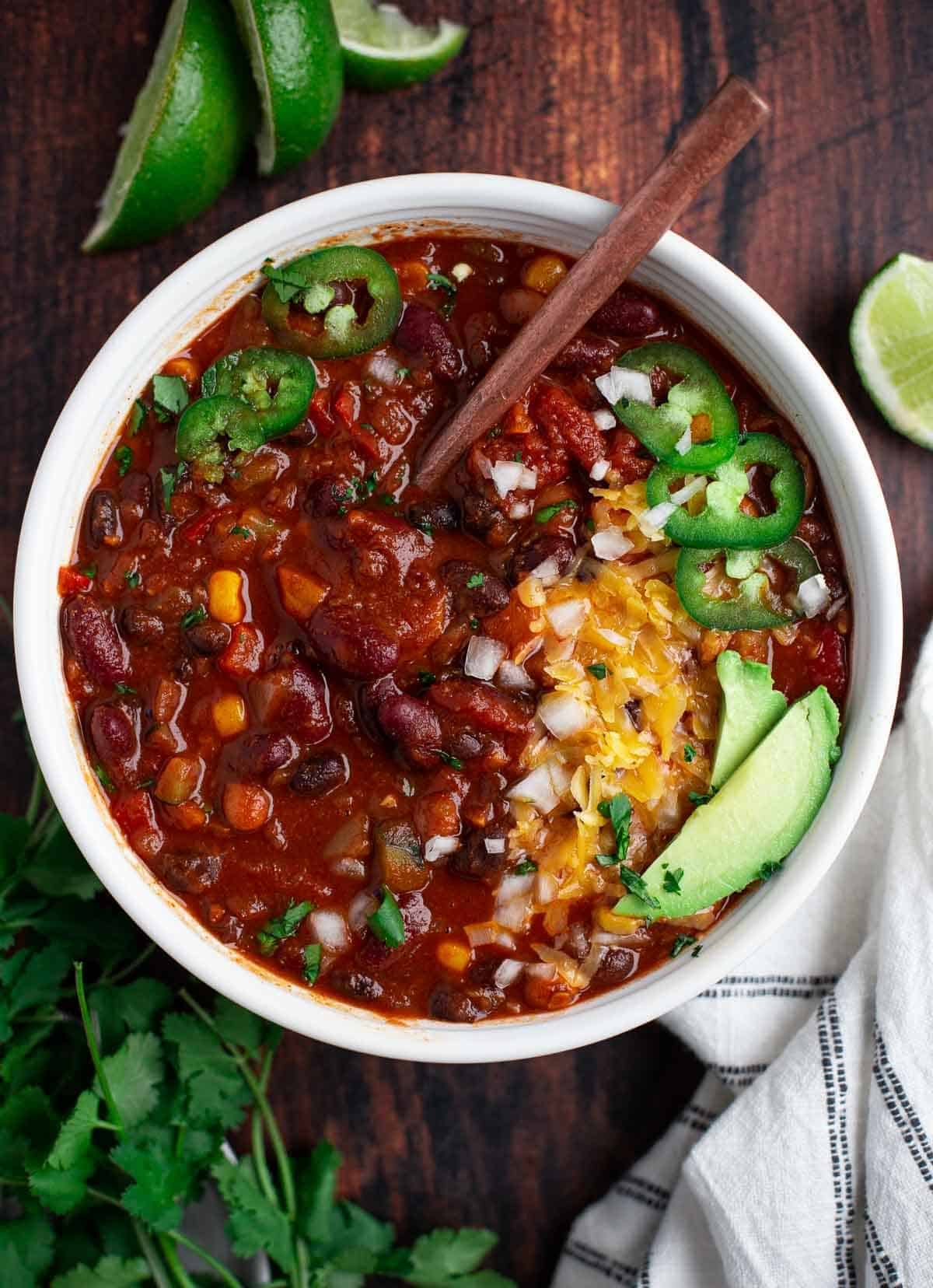 Vegetarian chili with toppings in a bowl.