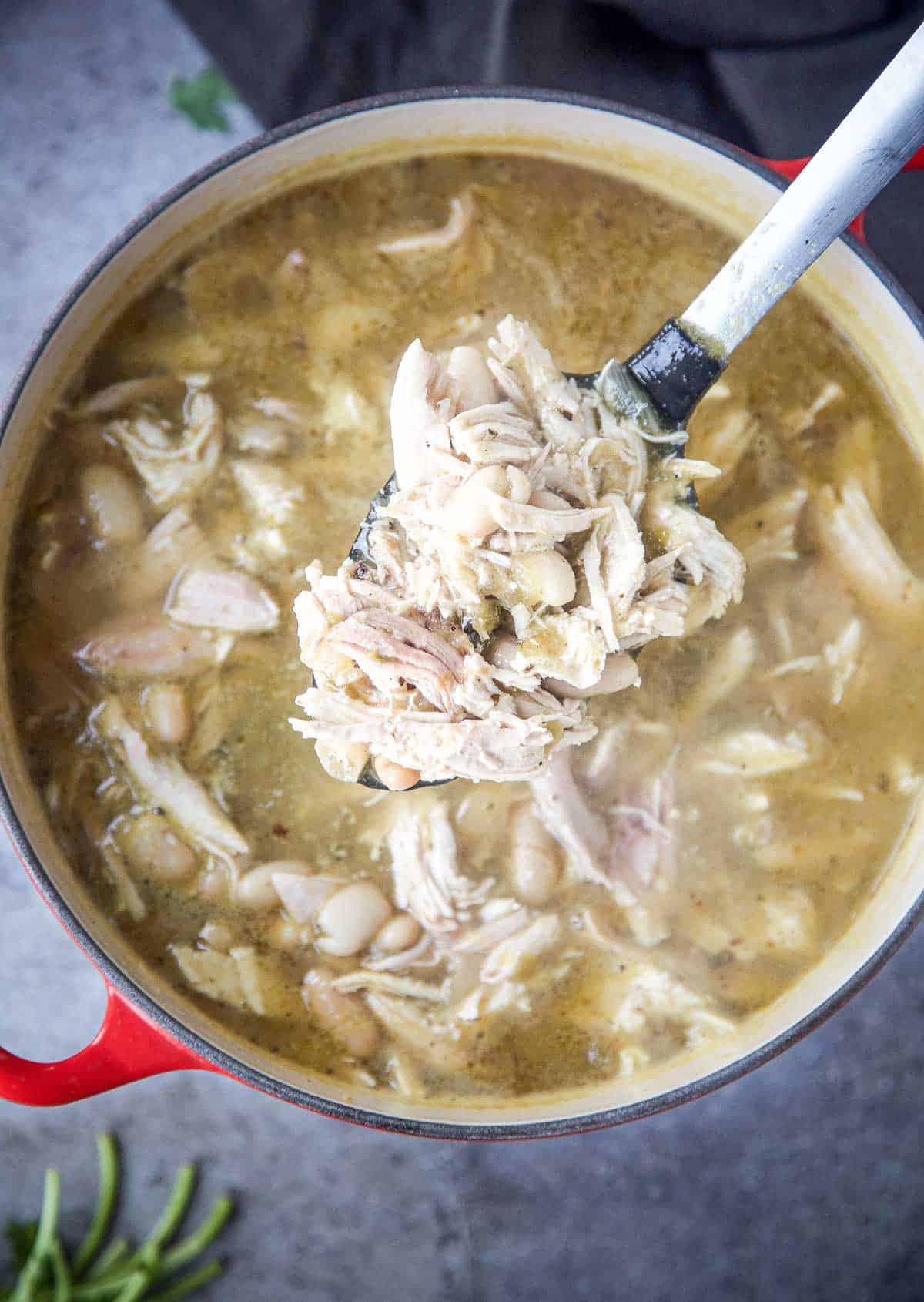 A large dutch oven filled with smoked chicken verde soup