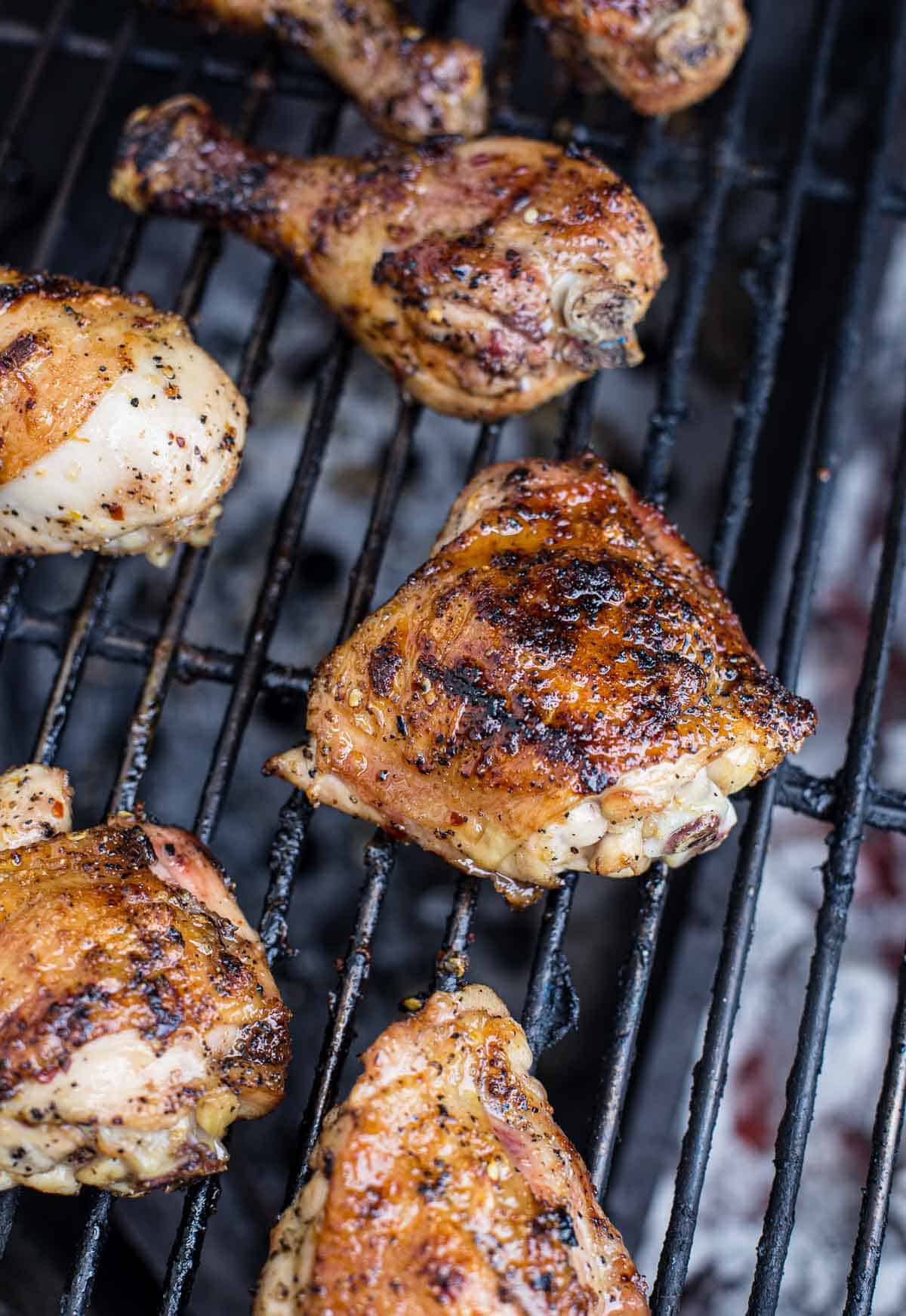 Grilling Hot Honey Chicken over the grill.
