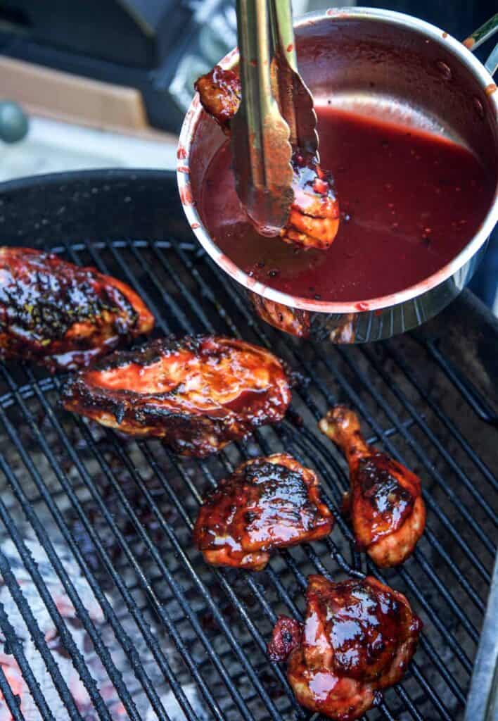 Glazing grilled chicken with a Blackberry BBQ Sauce