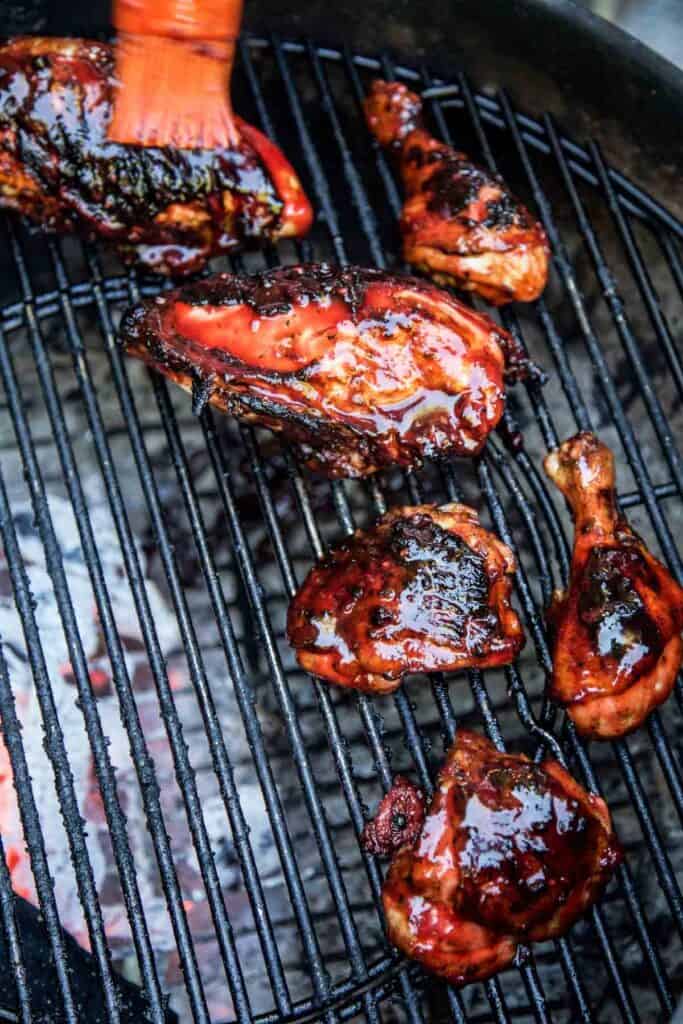 Glazing grilled chicken with a Blackberry BBQ Sauce