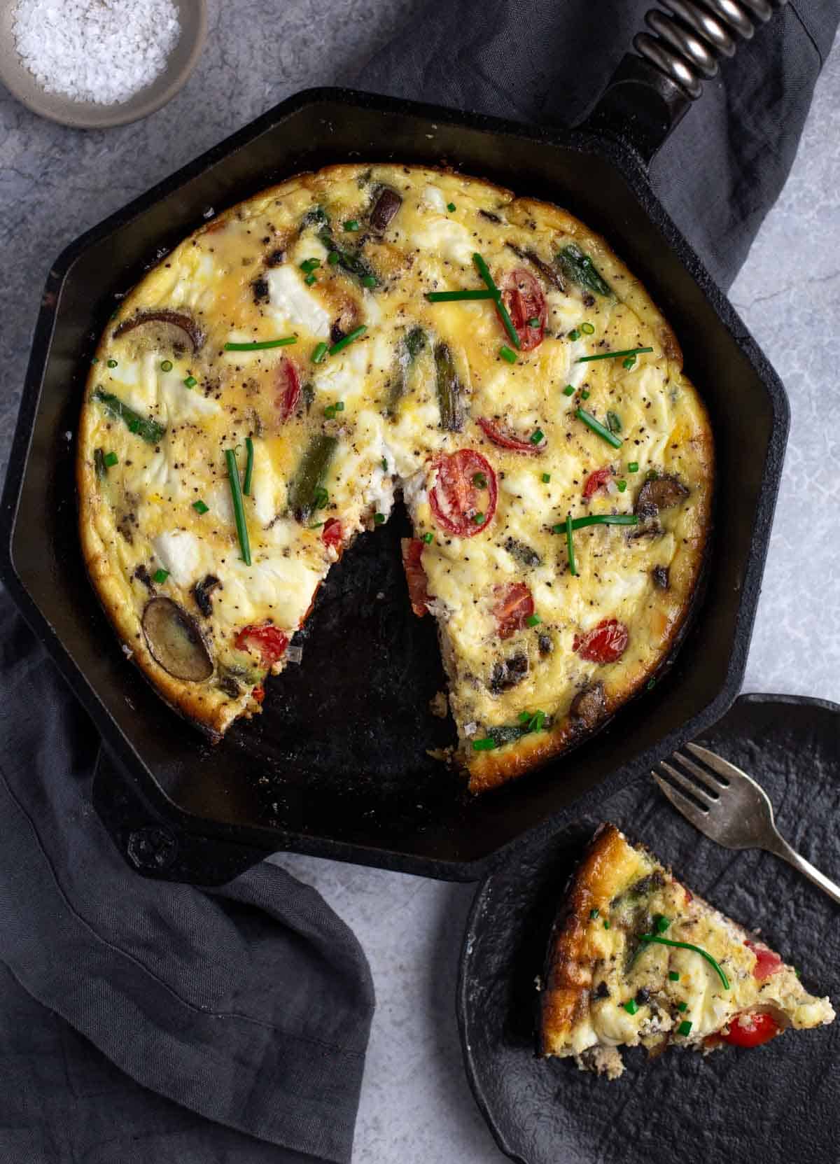 Grilled Vegetable Frittata with a slice of frittata on a small plate