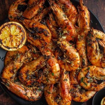 Grilled Prawns with a lemon garlic butter sauce on a serving platter