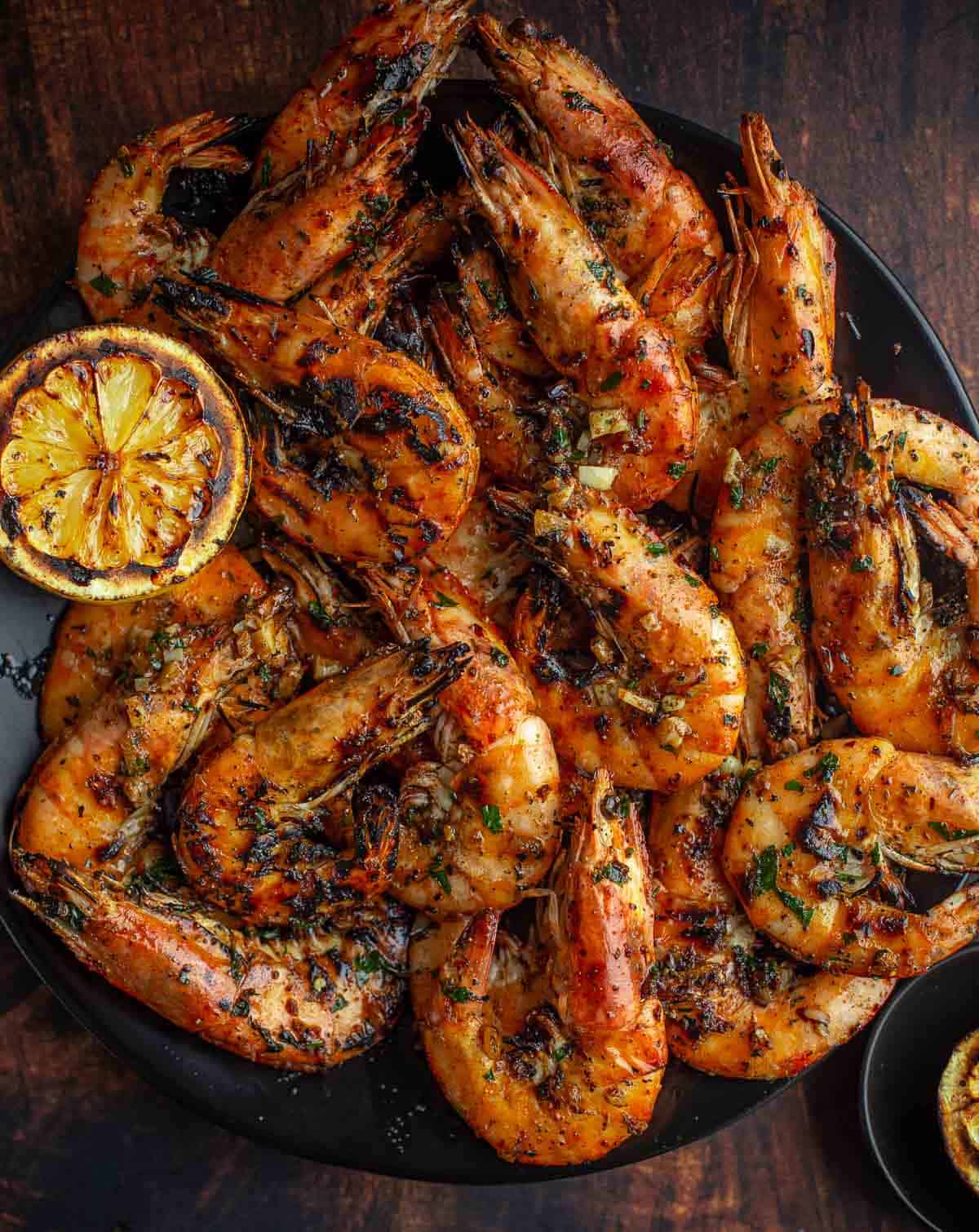 Grilled Prawns with a lemon garlic butter sauce on a serving platter