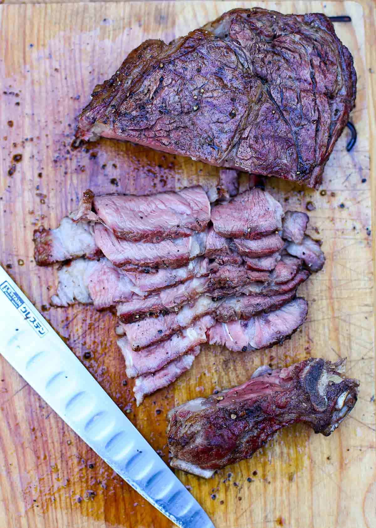 A Grilled Ribeye Steak sliced into thin slices