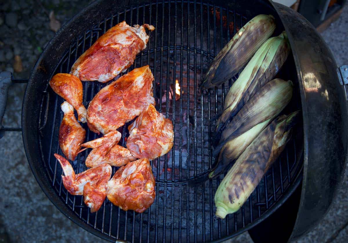 Grilling chicken and corn on a weber kettle grill