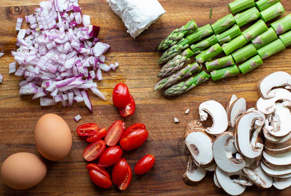 Ingredients for vegetable frittata on a cutting board