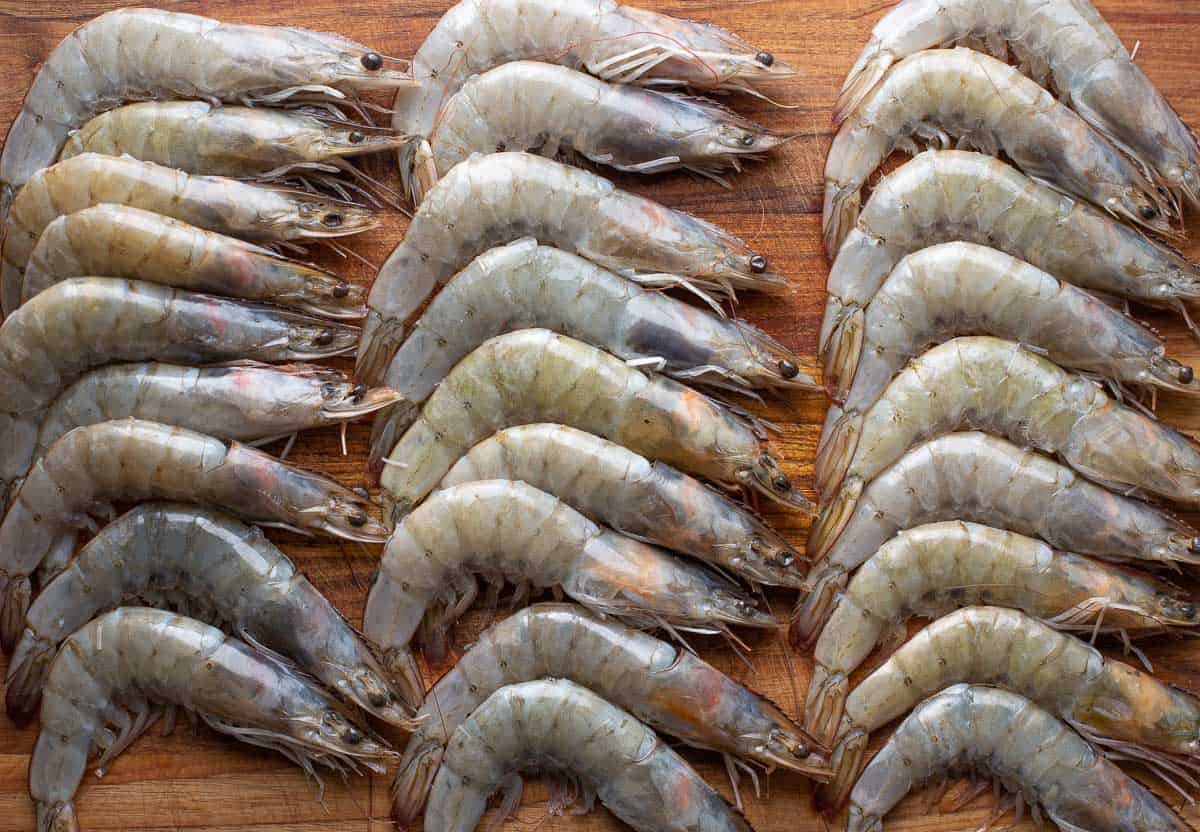 raw prawns on a cutting board