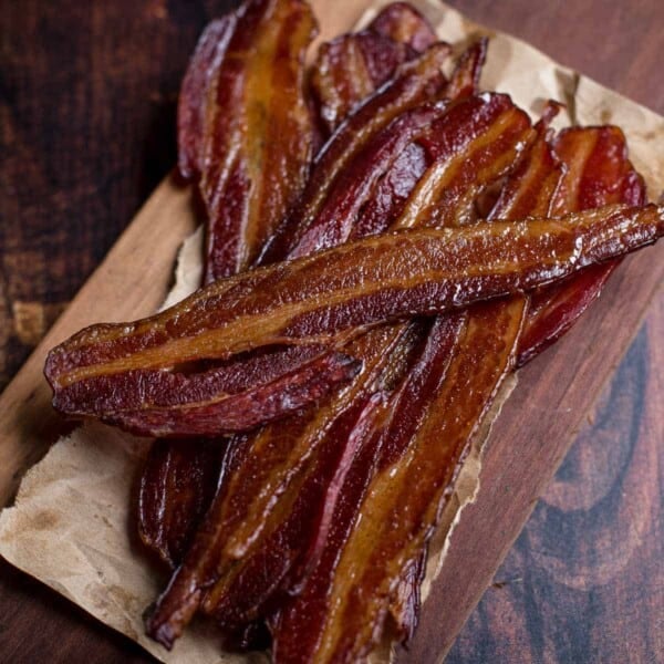 Slices of crispy smoked bacon on a serving tray