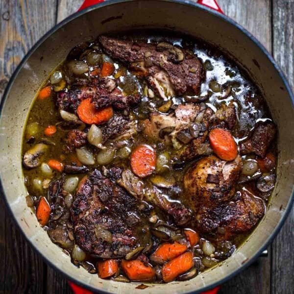 Classic Coq au Vin made with smoked chicken, in a large dutch oven
