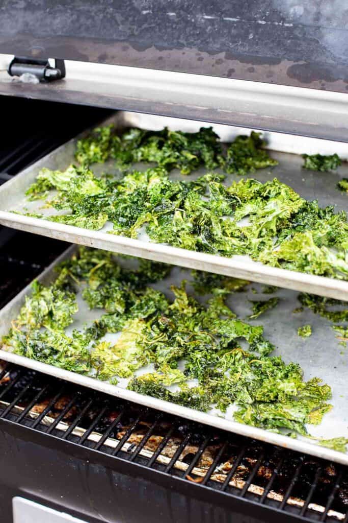 crispy smoked kale chips cooking in the smoker