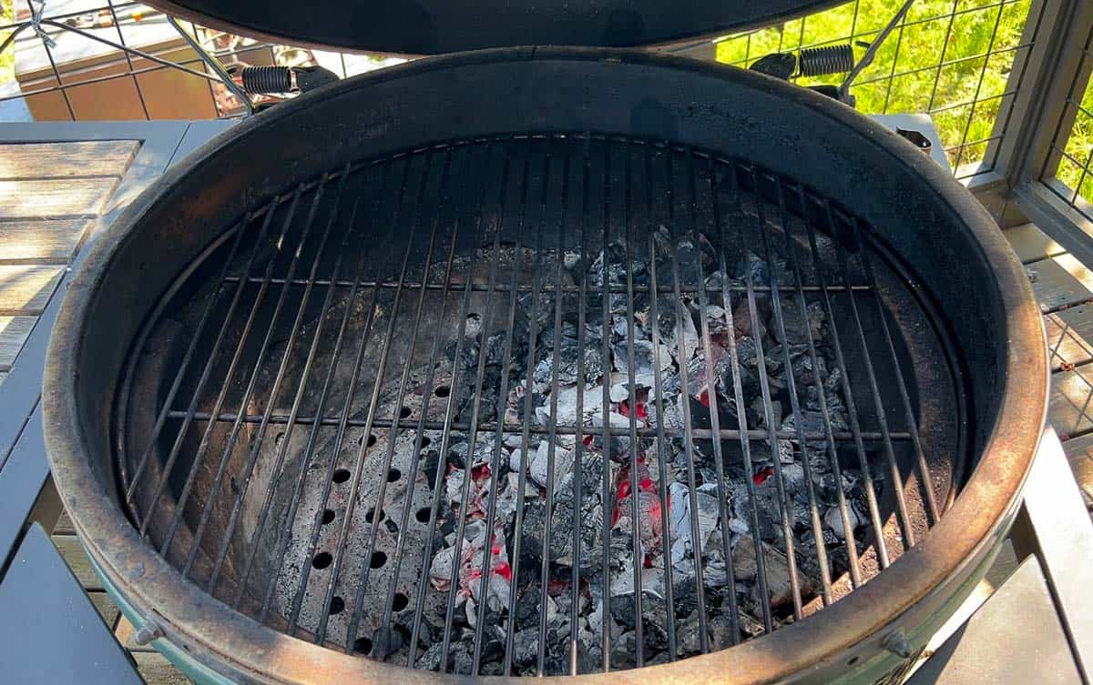 Big Green Egg set up with two zone grilling without using the charcoal basket.