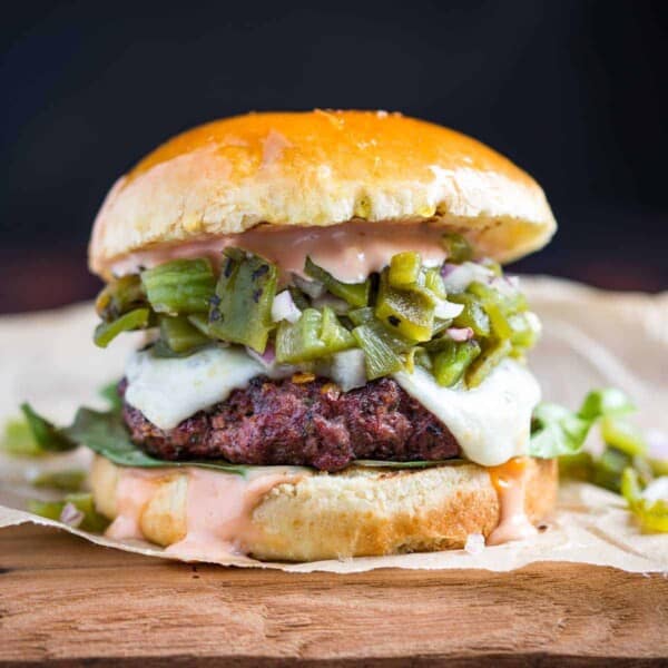 hatch green chile burger on a brioche bun.