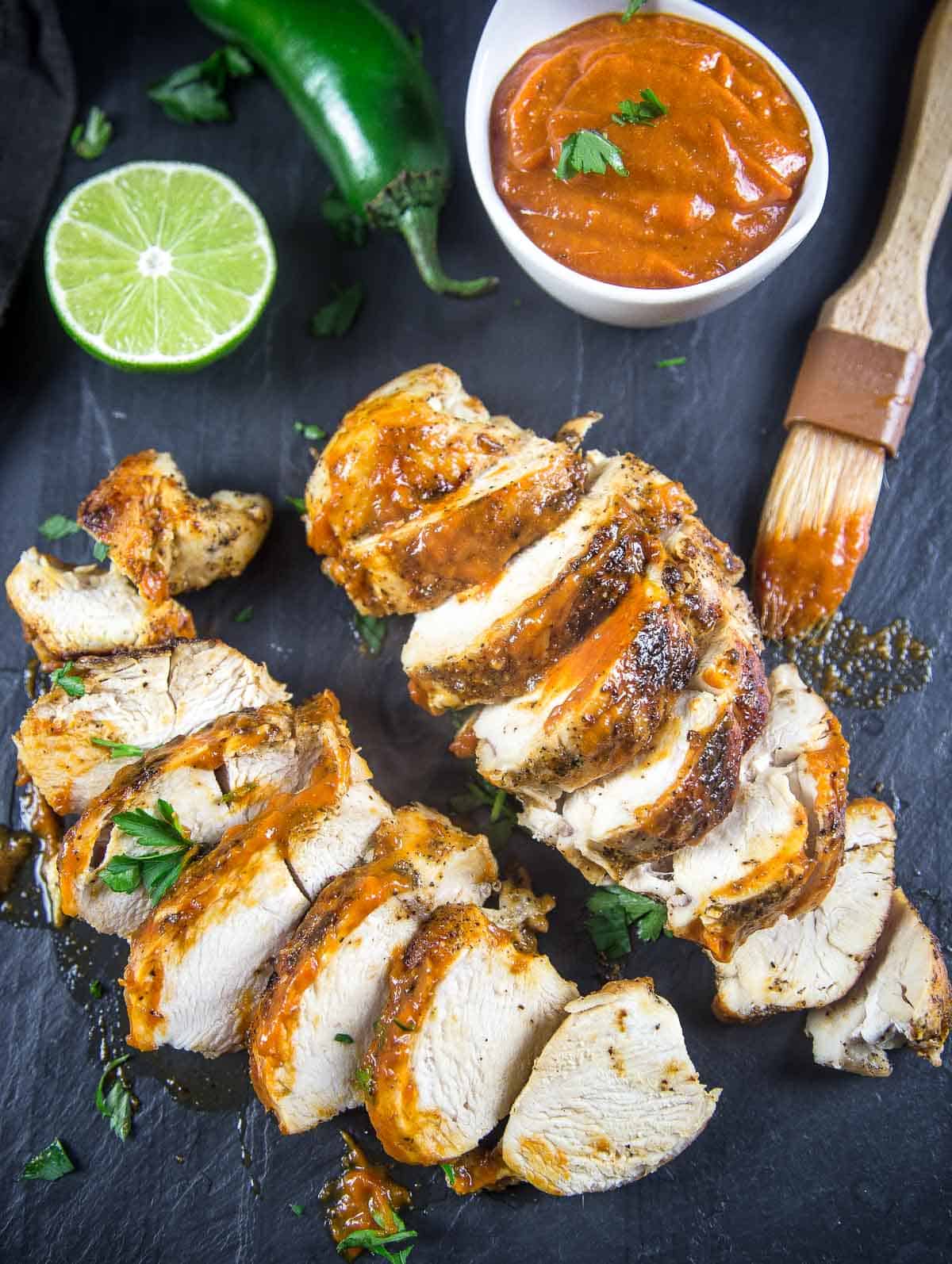 Mango Jalapeno BBQ Sauce drizzled over slices of grilled chicken