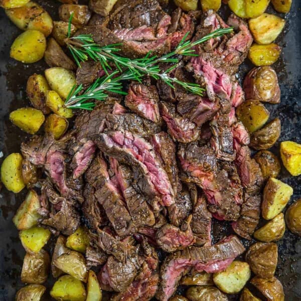 Grilled skirt steak cooked to medium rare and served over roasted potatoes.
