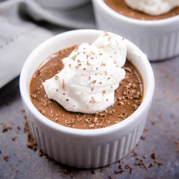 Smoked Chocolate Pot de Creme in a ramekin topped with whipped cream