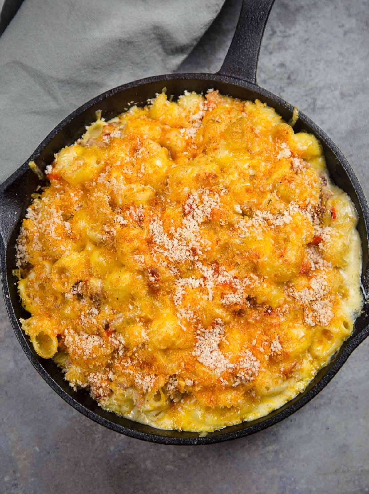 Tri tip Mac and Cheese in a cast iron pan.