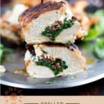 A grilled stuffed chicken breast that has been sliced in half and stacked