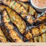 a tray of grilled crispy potato wedges with a homemade fry sauce