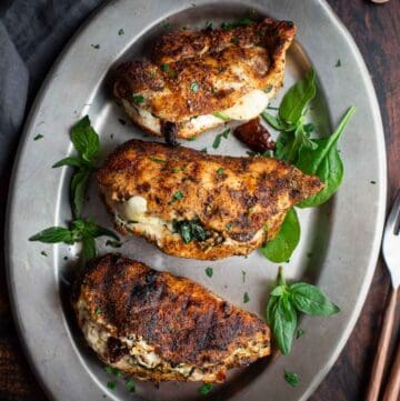 Grilled Stuffed Chicken Breasts with Spinach and Goat Cheese on a serving platter