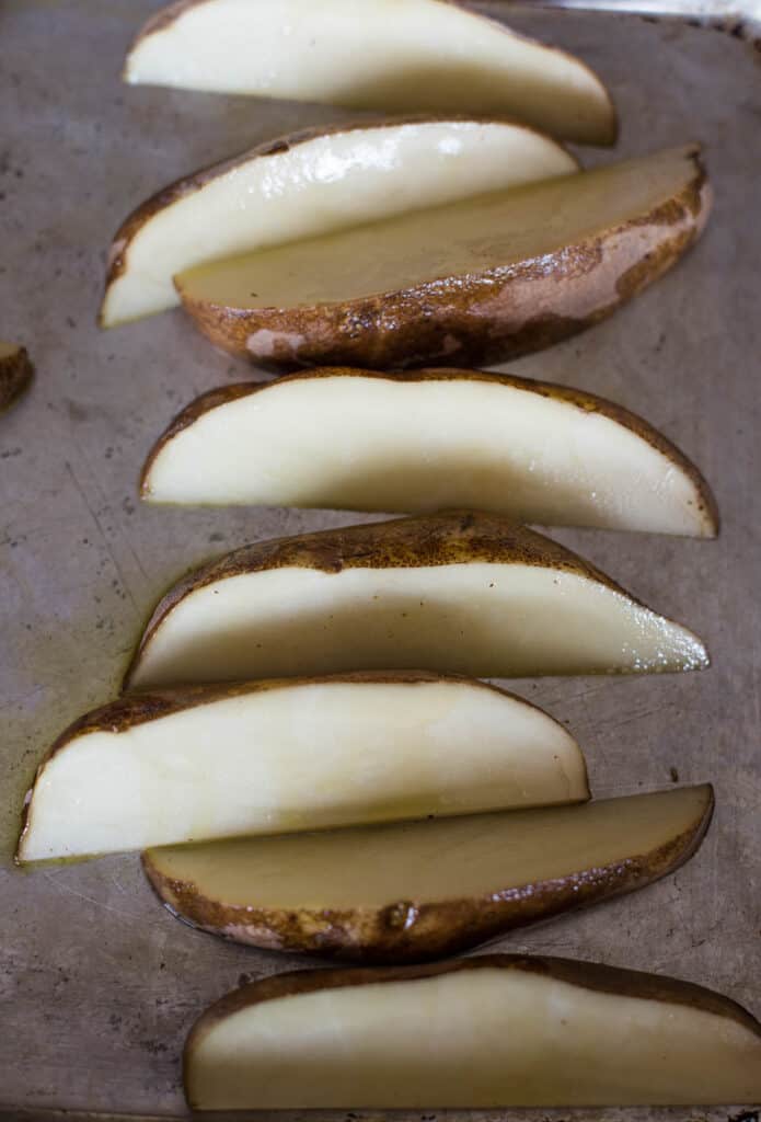 Raw potato wedges before seasoning.